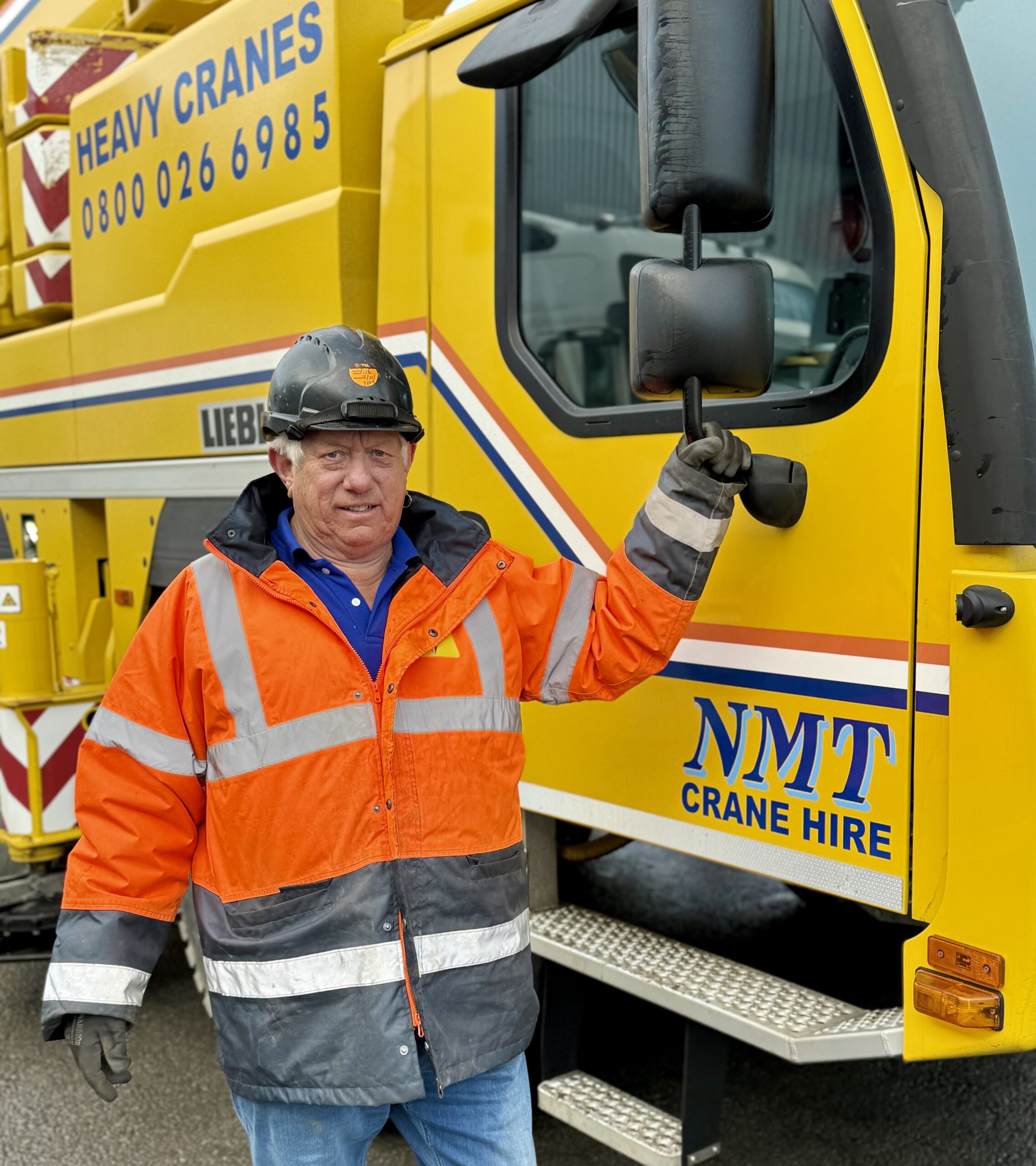 NMT worker next to Heavy Vehicle